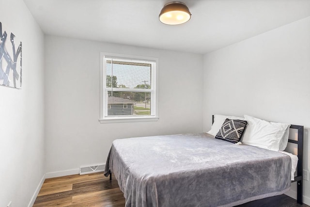 bedroom featuring dark wood-type flooring