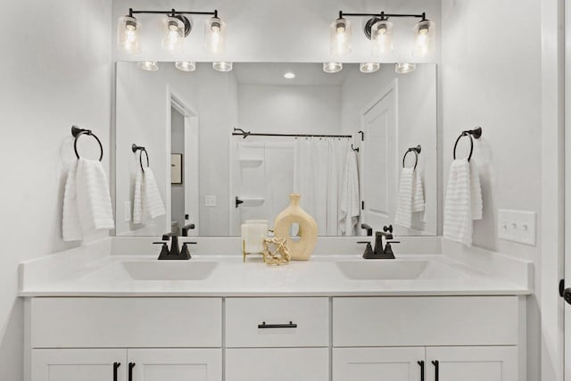 bathroom with vanity and curtained shower