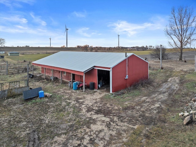 view of outdoor structure with a rural view