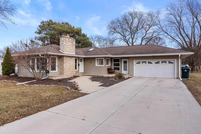 ranch-style house with a garage and a front lawn