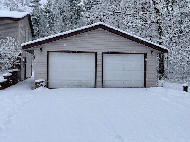 view of snow covered garage