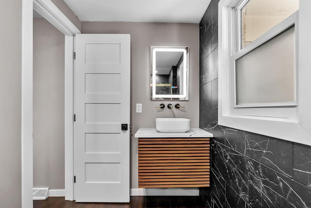 bathroom featuring hardwood / wood-style flooring and vanity