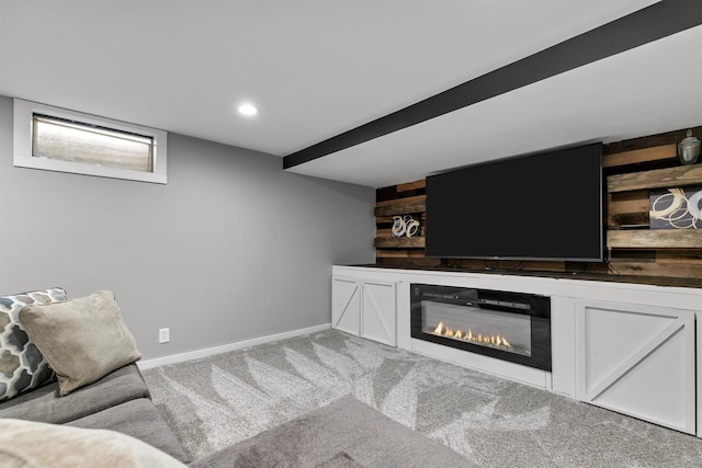 living room featuring wooden walls and carpet