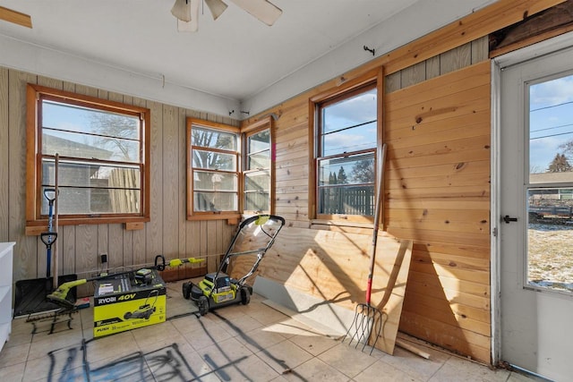 sunroom featuring ceiling fan