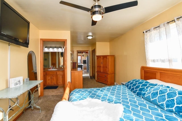 carpeted bedroom featuring connected bathroom and ceiling fan