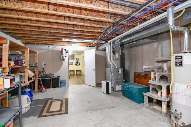 basement with heating unit and gas water heater