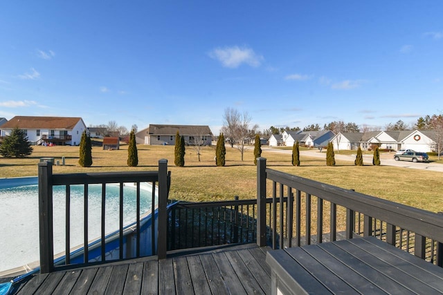 wooden deck with a yard