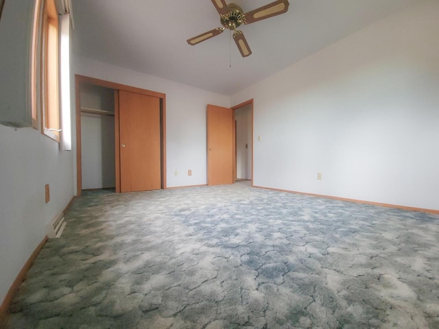 unfurnished bedroom with carpet flooring, a closet, and ceiling fan