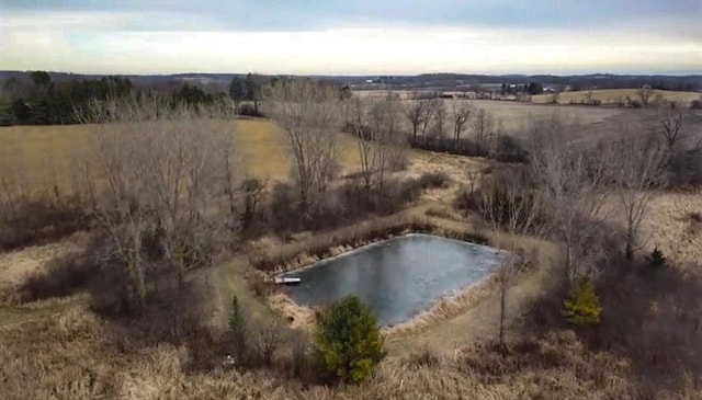 bird's eye view with a water view and a rural view