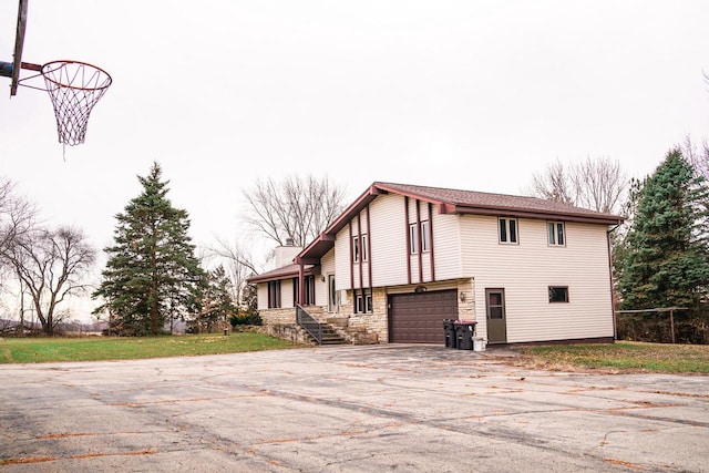 view of side of home featuring a garage