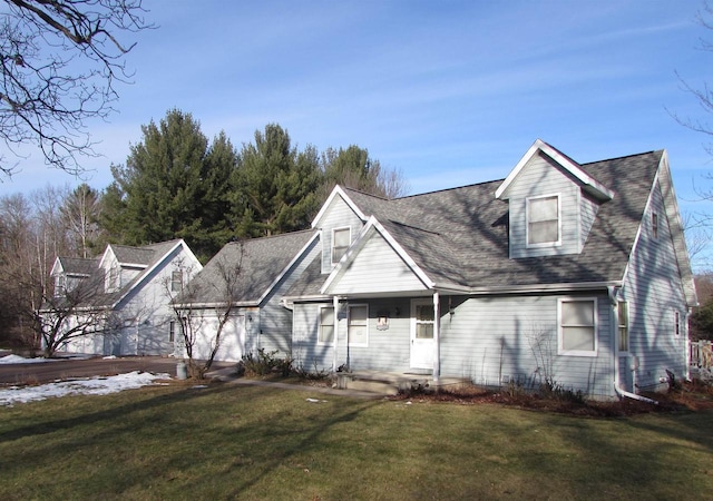 new england style home featuring a front lawn