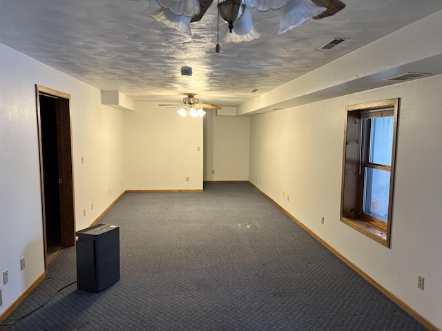 empty room with carpet flooring and ceiling fan