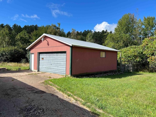 garage with a yard