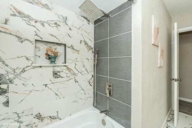 bathroom featuring washtub / shower combination