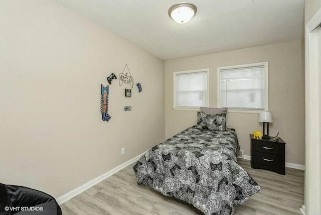 bedroom with light hardwood / wood-style floors