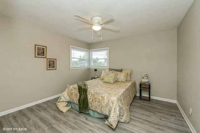 bedroom featuring hardwood / wood-style floors and ceiling fan