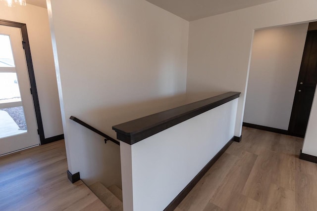 corridor featuring light hardwood / wood-style flooring