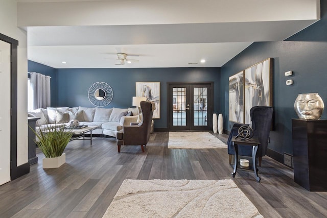 living room with dark hardwood / wood-style flooring, ceiling fan, and french doors