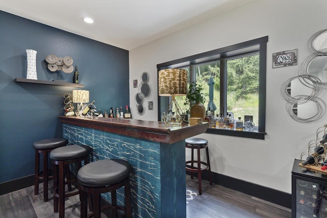 bar with dark wood-type flooring