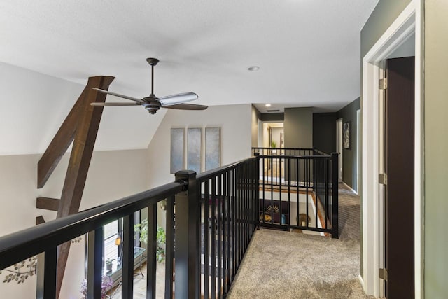 hall with light carpet and lofted ceiling