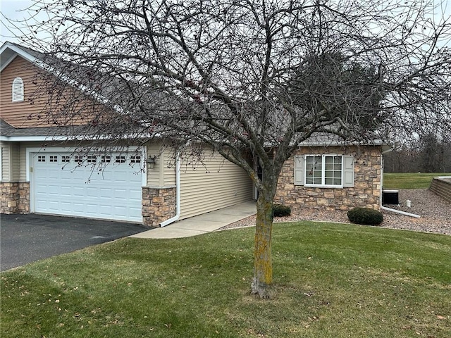 view of property exterior featuring a garage and a lawn