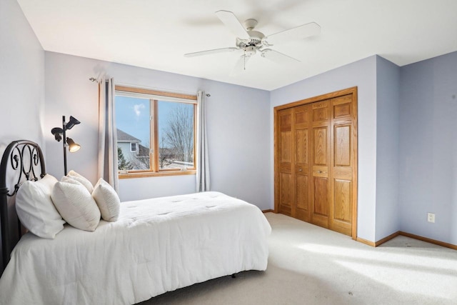 bedroom featuring ceiling fan, carpet flooring, and a closet