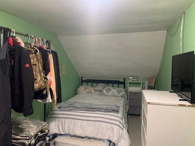 bedroom with lofted ceiling