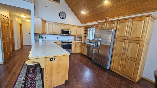 kitchen with wood ceiling, a breakfast bar area, appliances with stainless steel finishes, high vaulted ceiling, and a kitchen island