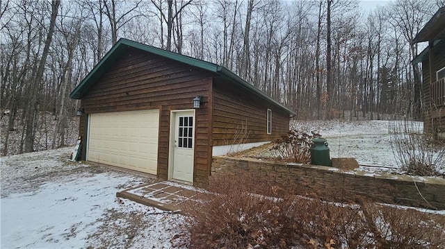 view of snow covered garage