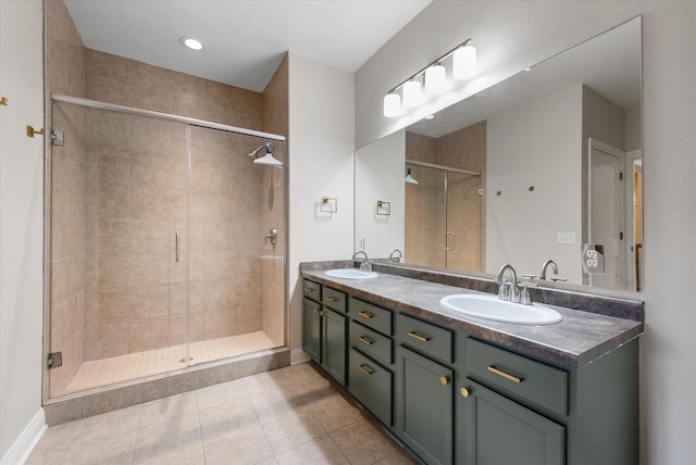 bathroom featuring vanity, tile patterned floors, and walk in shower