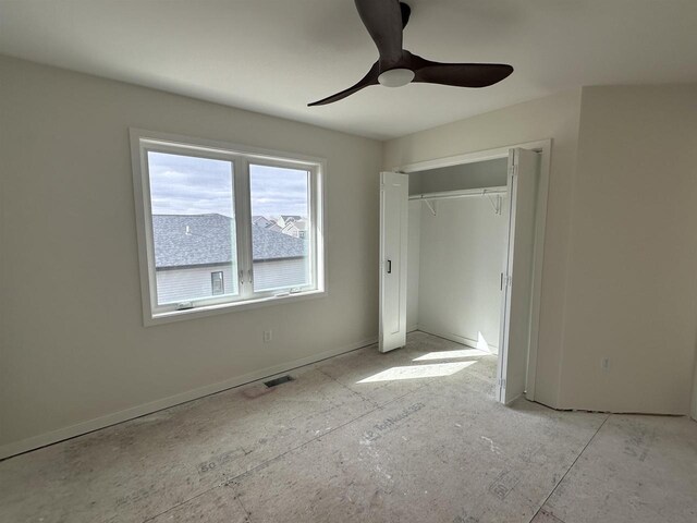 unfurnished bedroom with ceiling fan, visible vents, and a closet