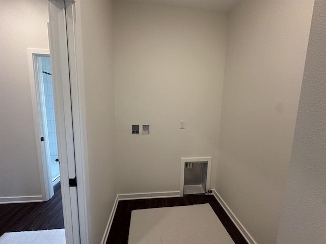 laundry area with dark wood-style flooring, washer hookup, baseboards, and laundry area