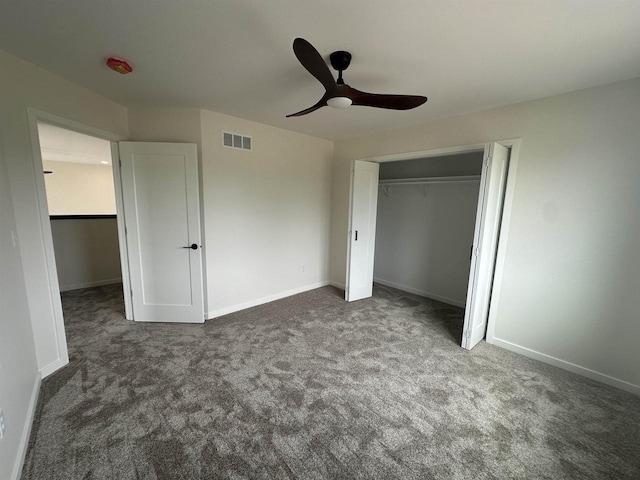 unfurnished bedroom with visible vents, baseboards, carpet floors, and a closet