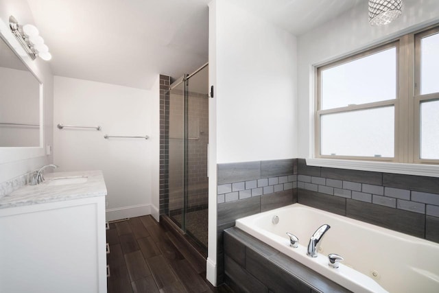 bathroom with separate shower and tub and vanity