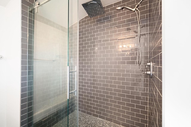 bathroom with a shower with shower door