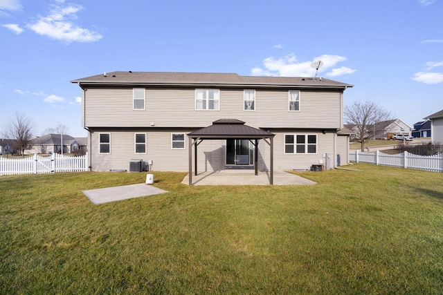 back of house featuring a gazebo, a patio, central AC unit, and a lawn