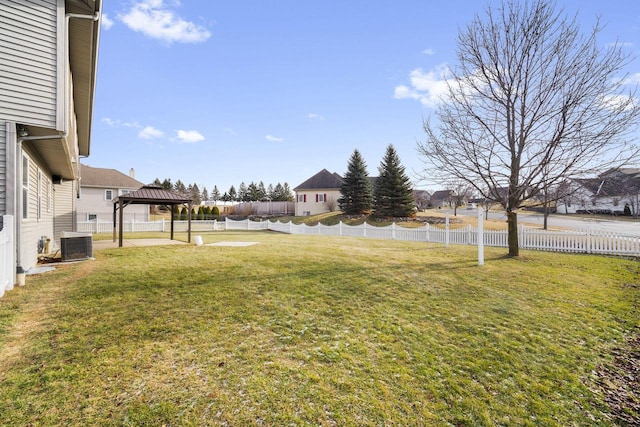 view of yard featuring a gazebo and central air condition unit