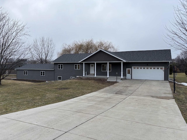 ranch-style home with a porch, a garage, and a front lawn