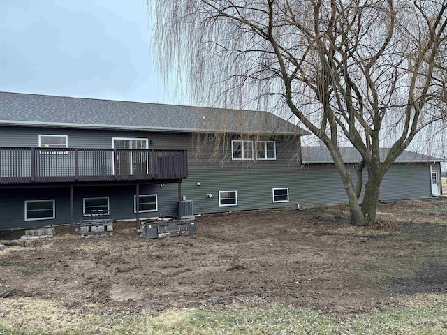 back of property featuring central air condition unit