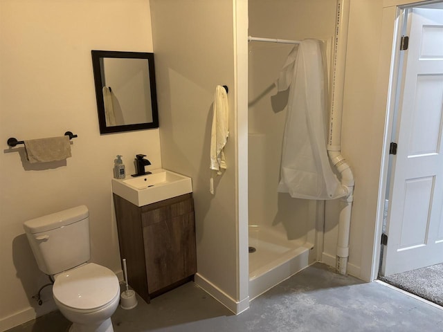 bathroom featuring a shower, vanity, concrete flooring, and toilet