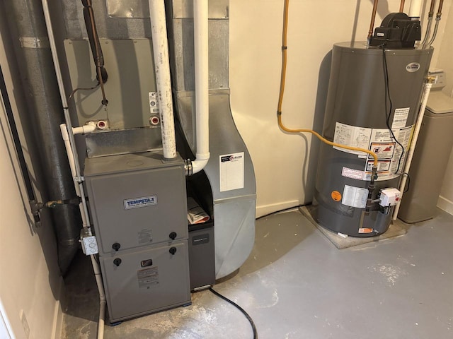 utility room with heating unit and gas water heater