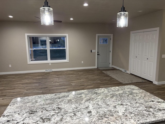 interior space with dark hardwood / wood-style flooring