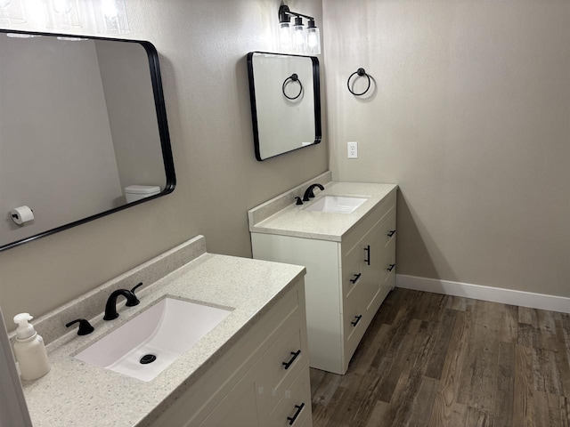 bathroom featuring vanity and wood-type flooring