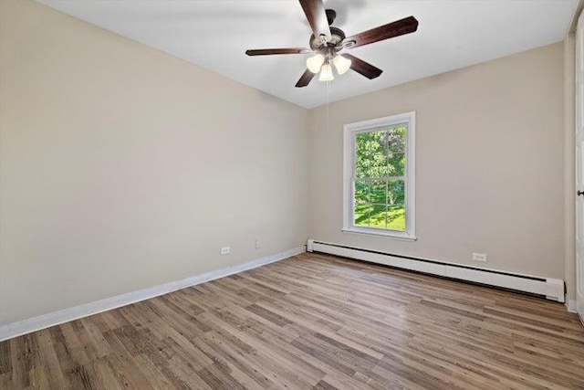 unfurnished room featuring baseboard heating, ceiling fan, and light wood-type flooring