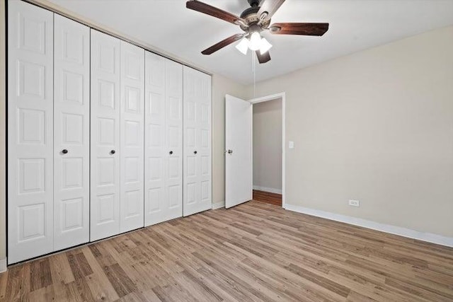 unfurnished bedroom with ceiling fan, a closet, and light hardwood / wood-style flooring