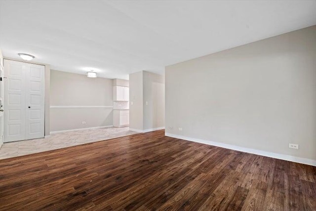 unfurnished room featuring hardwood / wood-style flooring