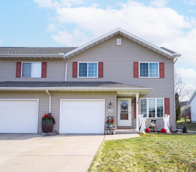 view of front facade featuring a garage and a front lawn