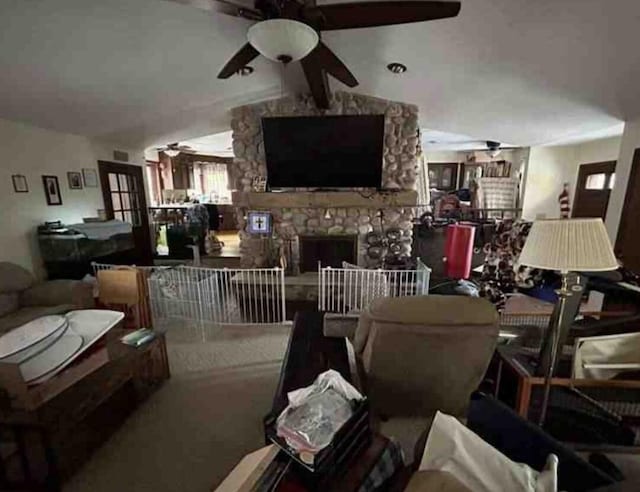 living room with a stone fireplace