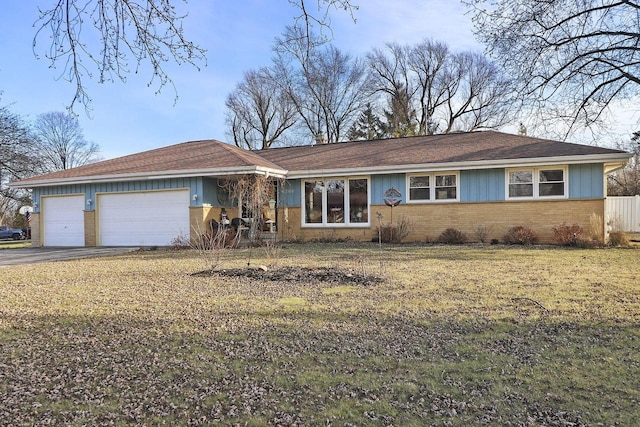 ranch-style house featuring a garage