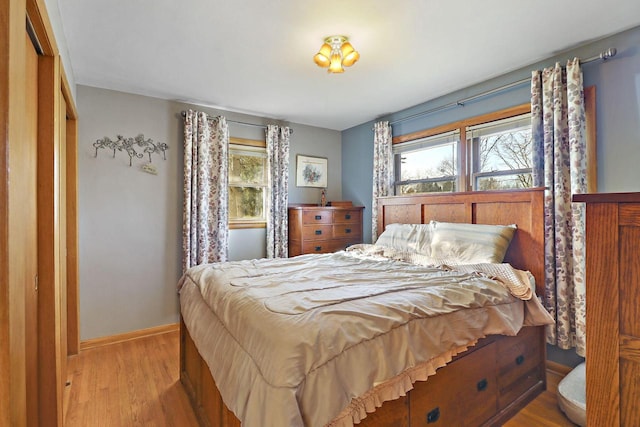 bedroom with light hardwood / wood-style flooring